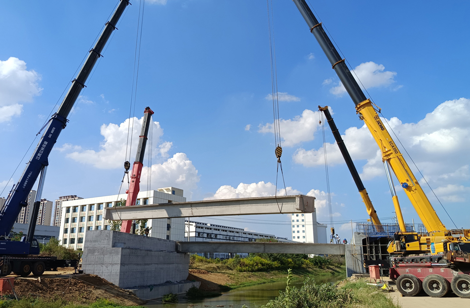 深南互通立交项目完成跨渠桥关键梁体吊装 6片大型箱梁精准安装 深南互通立交项目完成跨渠桥关键梁体吊装 6片大型箱梁精准安装